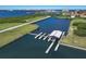 This aerial shows the community boat house and boat slips with access to the harbor at 1902 4Th E St, Palmetto, FL 34221