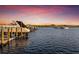 View of boats docked at the community marina at sunset at 1902 4Th E St, Palmetto, FL 34221