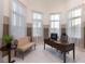 Inviting home office with large windows and a comfortable seating area at 1902 4Th E St, Palmetto, FL 34221