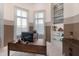 Bright office space with sleek dark wood desk and modern decor accents at 1902 4Th E St, Palmetto, FL 34221