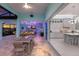 Spacious outdoor living area with waterfront views that opens to kitchen and bar area at 1902 4Th E St, Palmetto, FL 34221