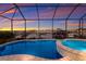 Enjoy breathtaking sunset views from the pool and spa in this waterfront home at 1902 4Th E St, Palmetto, FL 34221