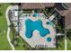 An aerial view shows a luxury community pool and spa with many seating options at 1902 4Th E St, Palmetto, FL 34221