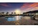 Community pool with ample seating and beautiful waterfront views at sunset at 1902 4Th E St, Palmetto, FL 34221