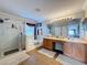 Bathroom with double vanity, garden tub, and walk-in shower at 19029 Chislehurst Dr, Land O Lakes, FL 34638