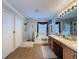 Main bathroom with double vanity, shower, and separate tub at 19029 Chislehurst Dr, Land O Lakes, FL 34638