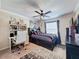 Cozy bedroom featuring a built-in desk and a comfortable bed at 19029 Chislehurst Dr, Land O Lakes, FL 34638