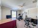 Versatile bonus room with exercise equipment and a workspace at 19029 Chislehurst Dr, Land O Lakes, FL 34638