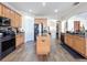 Eat-in kitchen with island, granite countertops, and stainless steel appliances at 19029 Chislehurst Dr, Land O Lakes, FL 34638