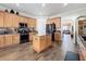 Spacious kitchen with island, stainless steel appliances, and wood cabinets at 19029 Chislehurst Dr, Land O Lakes, FL 34638
