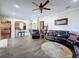 Open living room with kitchen view and comfortable seating at 19029 Chislehurst Dr, Land O Lakes, FL 34638