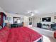 Large main bedroom with ensuite bathroom and TV at 19029 Chislehurst Dr, Land O Lakes, FL 34638