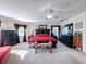 Main bedroom with king-size bed and walk-in closet at 19029 Chislehurst Dr, Land O Lakes, FL 34638