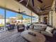 Relaxing covered patio with pool views and wicker furniture at 19029 Chislehurst Dr, Land O Lakes, FL 34638