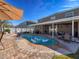 Resort-style pool with patio, covered lanai, and comfortable seating at 19029 Chislehurst Dr, Land O Lakes, FL 34638