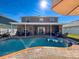 Expansive pool and patio with covered lanai and plenty of seating at 19029 Chislehurst Dr, Land O Lakes, FL 34638