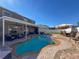 Large kidney-shaped pool with patio, covered lanai, and seating at 19029 Chislehurst Dr, Land O Lakes, FL 34638