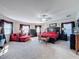 Spacious Primary bedroom with a king-size bed and sitting area at 19029 Chislehurst Dr, Land O Lakes, FL 34638