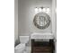 Modern powder room with a pedestal sink and a decorative mirror at 1903 Haven Bend, Tampa, FL 33613