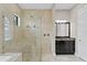 Elegant bathroom with a large shower, dark vanity, and a separate soaking tub at 1903 Haven Bend, Tampa, FL 33613