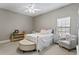 Charming bedroom with a metal bed frame and light decor at 1903 Haven Bend, Tampa, FL 33613