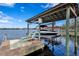 Private boat lift on a spacious dock with lounge chairs at 1903 Haven Bend, Tampa, FL 33613