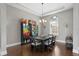 Bright dining room featuring a dark wood table with six chairs and a display cabinet at 1903 Haven Bend, Tampa, FL 33613