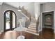 Elegant two-story entry with hardwood floors and modern light fixture at 1903 Haven Bend, Tampa, FL 33613
