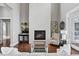 Modern fireplace with white stone surround and sleek glass doors at 1903 Haven Bend, Tampa, FL 33613