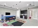 Game room with kitchenette, foosball table, and access to bathroom at 1903 Haven Bend, Tampa, FL 33613