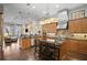 Open concept kitchen with island, stainless steel appliances, and hardwood floors at 1903 Haven Bend, Tampa, FL 33613