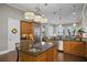 Large kitchen with island, stainless steel appliances, and hardwood floors at 1903 Haven Bend, Tampa, FL 33613
