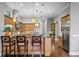 Kitchen with light wood cabinets, granite countertops, and stainless steel appliances at 1903 Haven Bend, Tampa, FL 33613