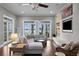 Living room with a sectional sofa and stunning lake views from multiple windows at 1903 Haven Bend, Tampa, FL 33613