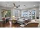 Spacious living area showcasing a sectional sofa, lake views, and a casual dining space at 1903 Haven Bend, Tampa, FL 33613