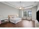 Bright main bedroom with large windows, hardwood floors and sitting area at 1903 Haven Bend, Tampa, FL 33613