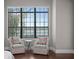 Main bedroom sitting area with water views and comfortable seating at 1903 Haven Bend, Tampa, FL 33613