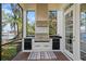Outdoor kitchen with stainless steel grill and lake view at 1903 Haven Bend, Tampa, FL 33613