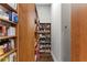 Well-organized pantry with wood shelving offering ample storage at 1903 Haven Bend, Tampa, FL 33613