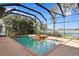 Enclosed pool and spa area with lake view at 1903 Haven Bend, Tampa, FL 33613