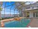 Enclosed pool and spa with lake view and home access at 1903 Haven Bend, Tampa, FL 33613