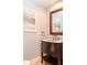 Modern bathroom with dark vanity and framed artwork at 200 4Th S Ave # 139, St Petersburg, FL 33701