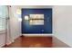 Bright dining room features hardwood floors and a stylish blue accent wall at 200 4Th S Ave # 139, St Petersburg, FL 33701