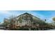 Building exterior showcasing Spanish-style architecture, lush landscaping, and a vibrant streetscape at 200 4Th S Ave # 139, St Petersburg, FL 33701