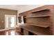 Living room with built-in shelving unit and hardwood floors at 200 4Th S Ave # 139, St Petersburg, FL 33701