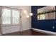 Living room with hardwood floors and window with plantation shutters at 200 4Th S Ave # 139, St Petersburg, FL 33701