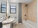 Well-maintained bathroom with a tub-shower combination, toilet, and a stylish vanity at 2109 Bayshore Blvd # 704, Tampa, FL 33606