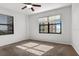 Cozy bedroom with a ceiling fan and large windows showcasing city and water views at 2109 Bayshore Blvd # 704, Tampa, FL 33606