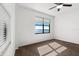 The bedroom features a neutral carpet and a window with a water view at 2109 Bayshore Blvd # 704, Tampa, FL 33606