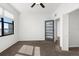 Bright bedroom featuring a ceiling fan, a large window, and a stylish glass door at 2109 Bayshore Blvd # 704, Tampa, FL 33606